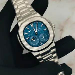Buy Patek Philippe Nautilus Moon Phase Blue Striped Dial Steel