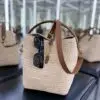 Design LE 37 IN WOVEN RAFFIA AND VEGETABLE-TANNED LEATHER - Dubai Fashion LUX