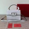 Small Vsling Grainy Calfskin Handbag Coral - Dubai Fashion LUX