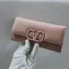 VLogo Signature grainy calfskin wallet with chain strap. - Dubai Fashion LUX